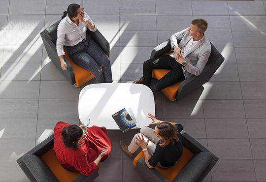 Cambridge Enterprise staff talking around a table