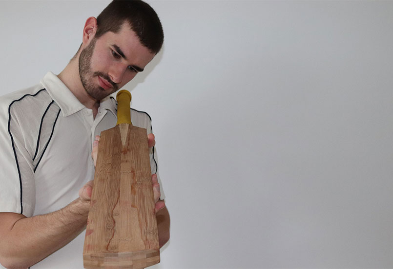 Man holding prototype bamboo bat
