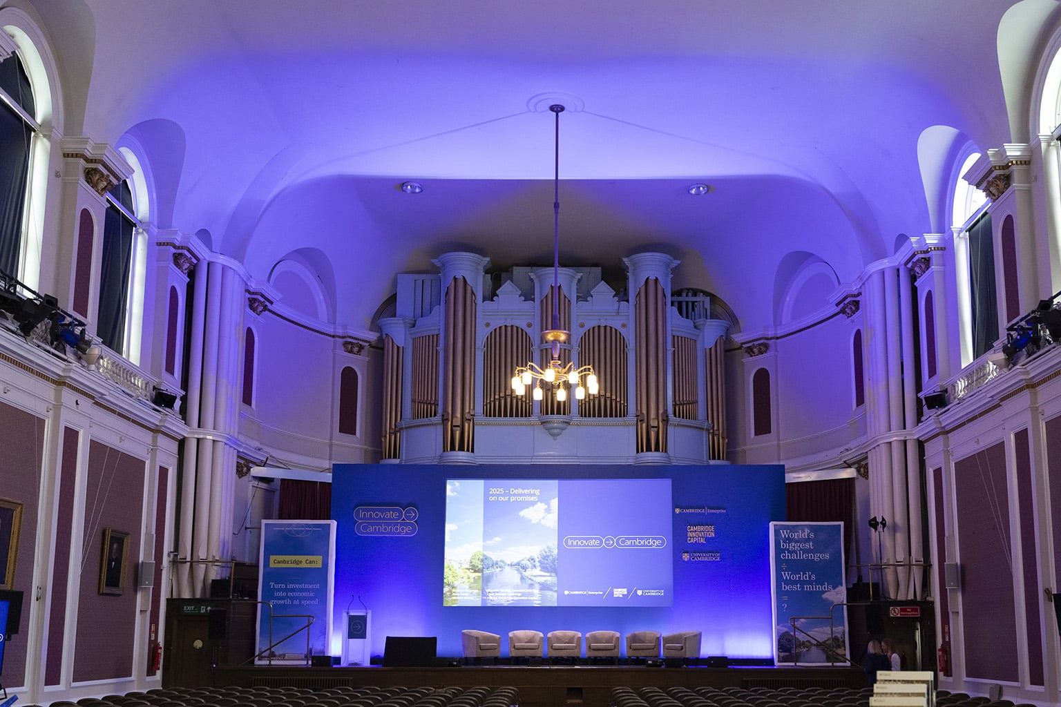 A blue conference stage in a large room